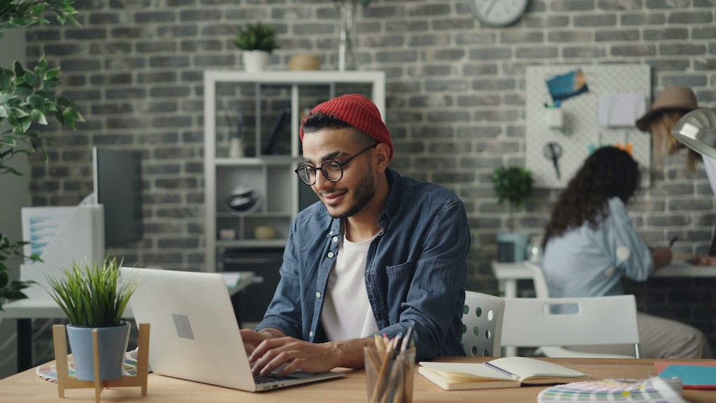 A person receiving an order notification email on their laptop